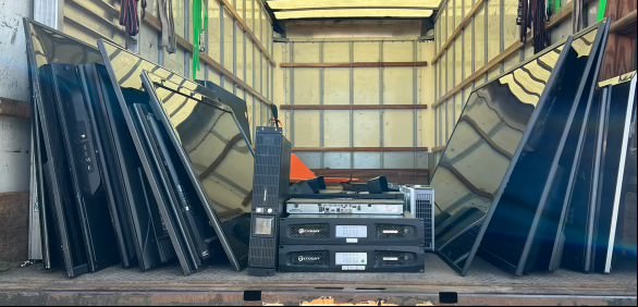 truck full of flat-screen televisions and receivers
